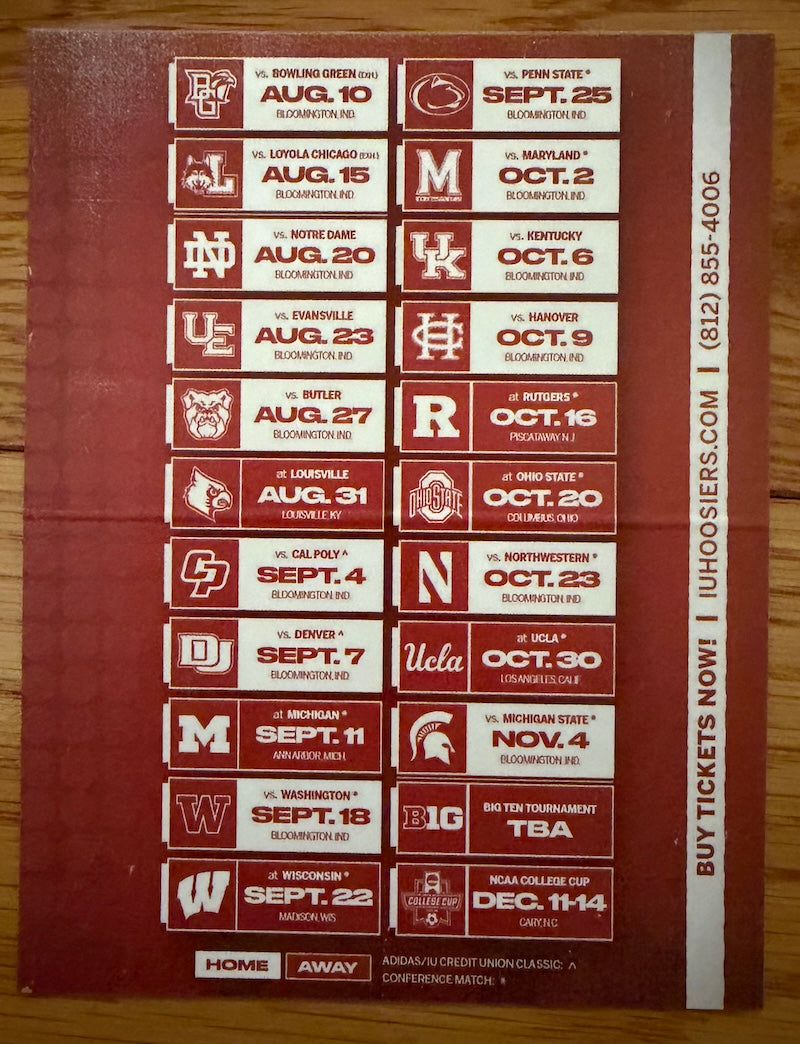 A rectangular maroon and white UH Hokies football ticketing sheet featuring multiple college game listings with dates, opponents, and team logos, photographed flat on a wooden surface.