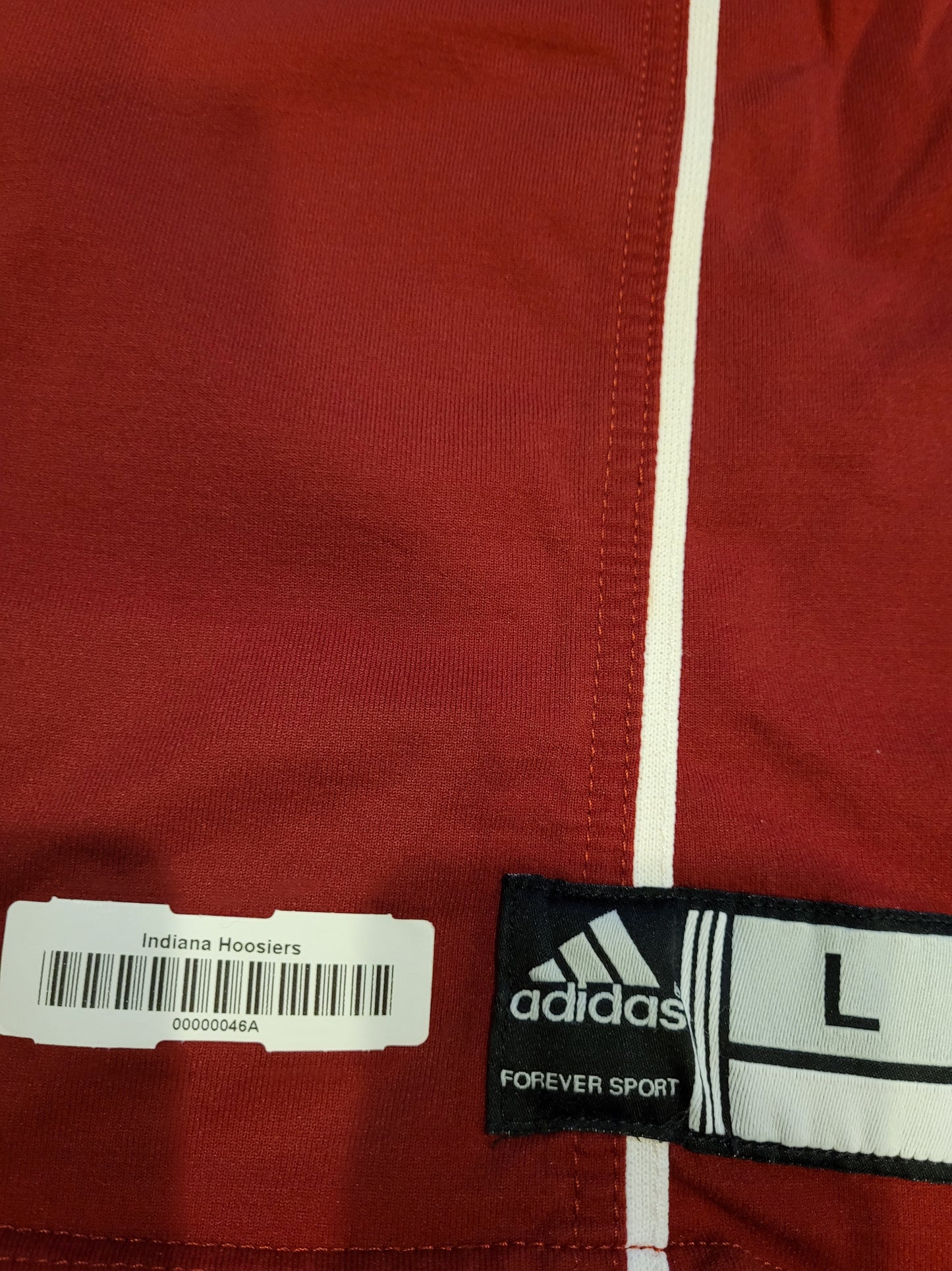 Tag on lower portion of jersey.