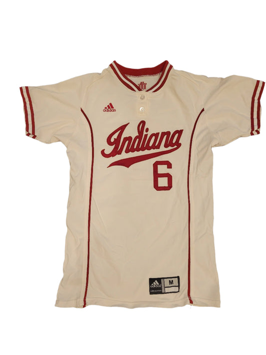 An Indiana University softball jersey in beige with red and black details, featuring the number 6 and the Indiana logo.