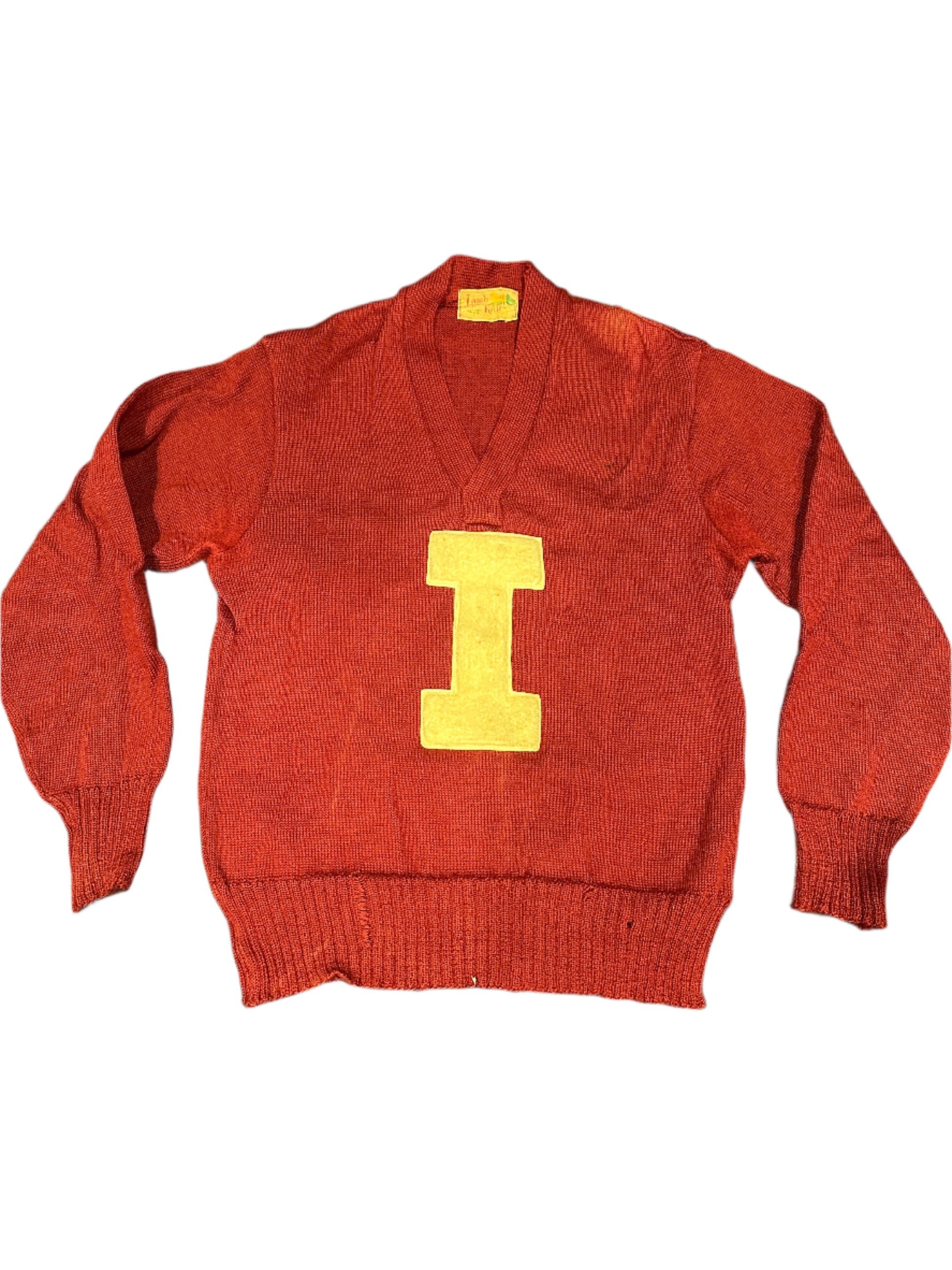 Vintage red sweater with a yellow 'I' on the front, and small yellow text that reads 'Jon Morehead'.