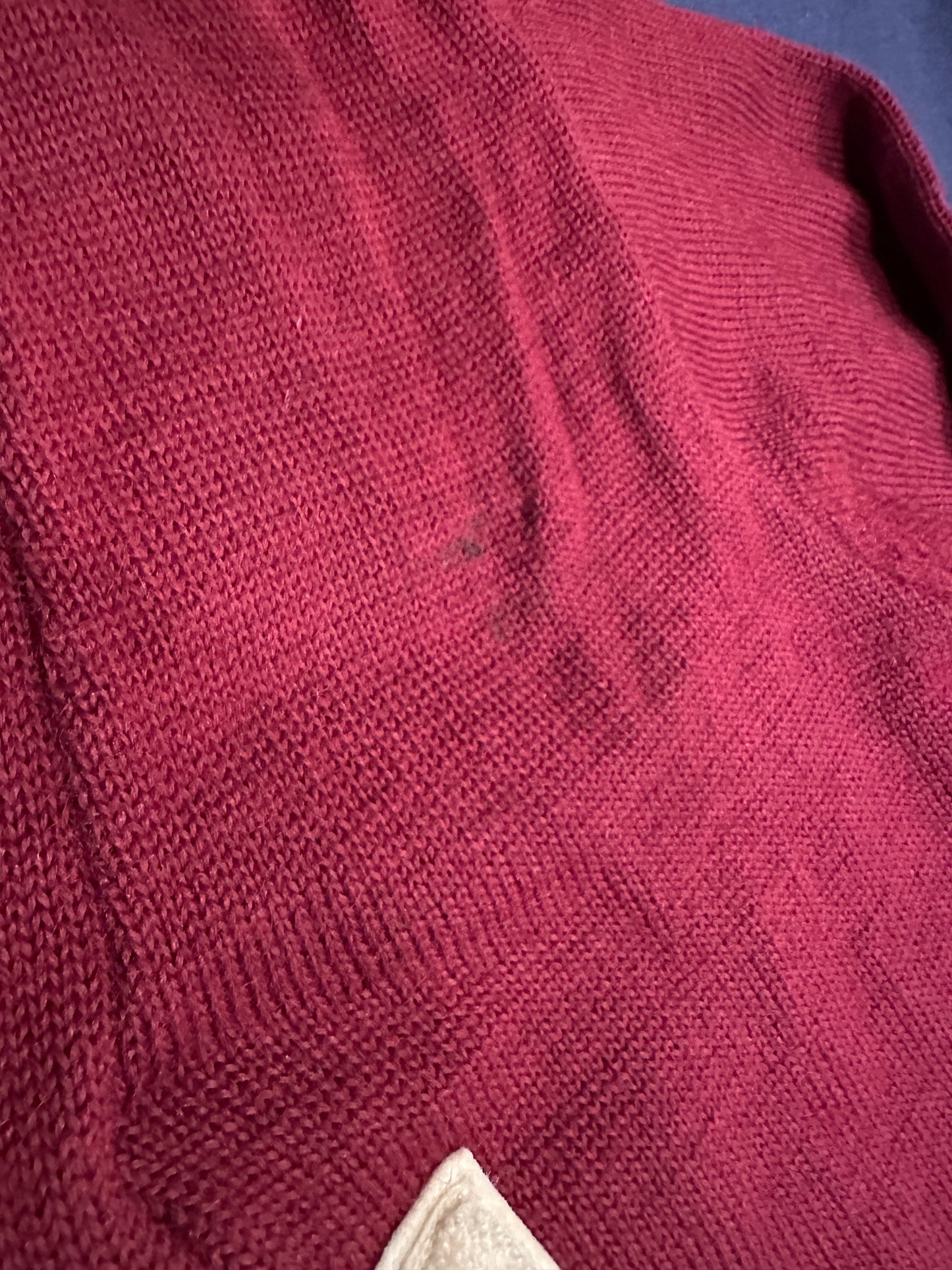 Close up of minor staining on front of sweater.
