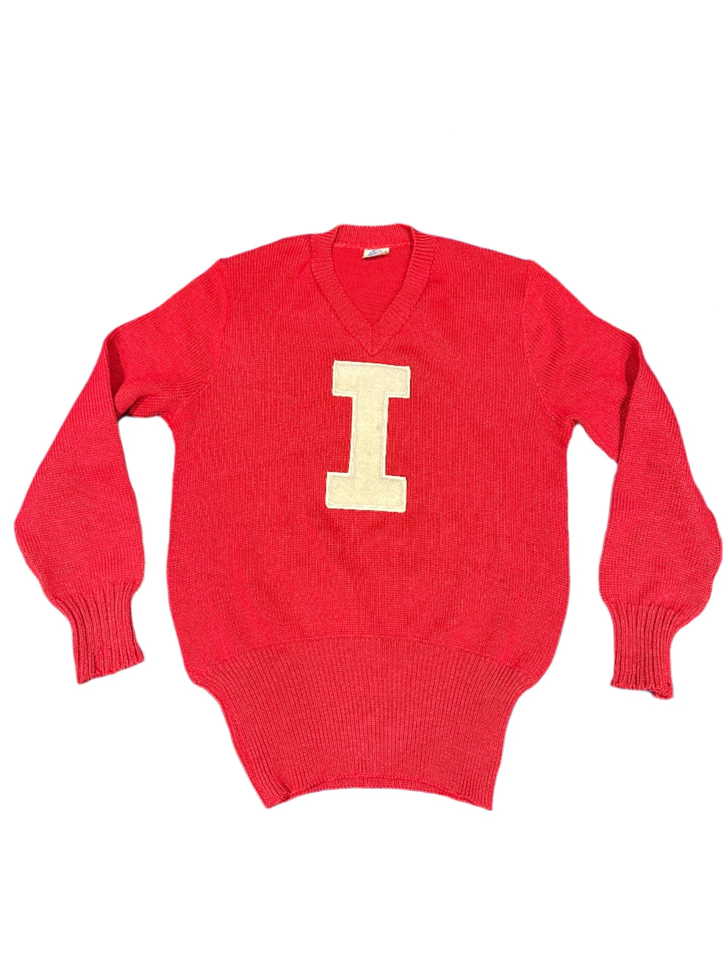 Vintage red sweater with a large yellow 'I' on the front, presumably from Indiana University, with visible signs of wear.